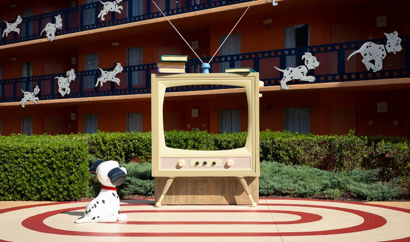 A Dalmatian looks at a TV at Disney's All-Star Movies Resort