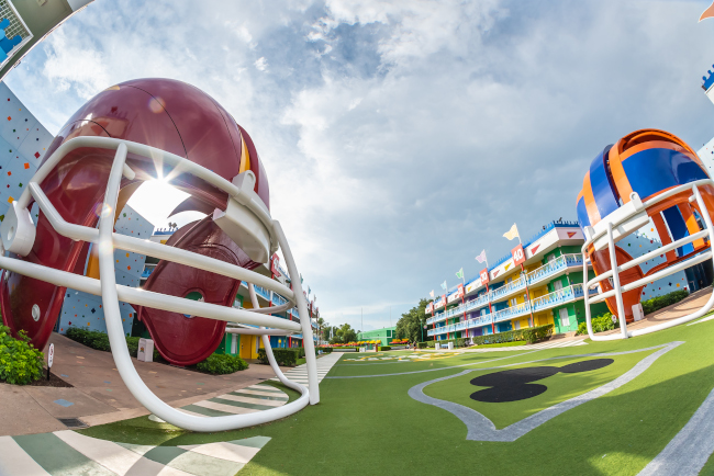 Giant football helmets flank the field at Disney's All-Star Sports Resort